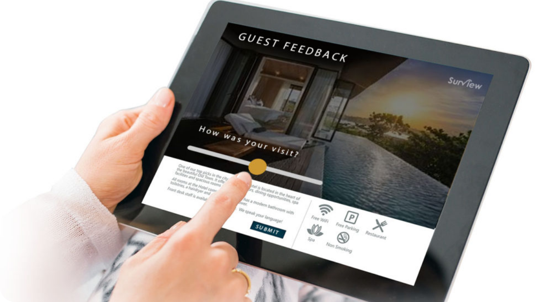 person writing in a notebook beside by an iPad, laptop, printed photos, spectacles, and a cup of coffee on a saucer